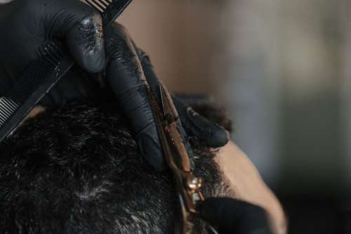 A Barbers Hands Trim A Customers Hair Photo