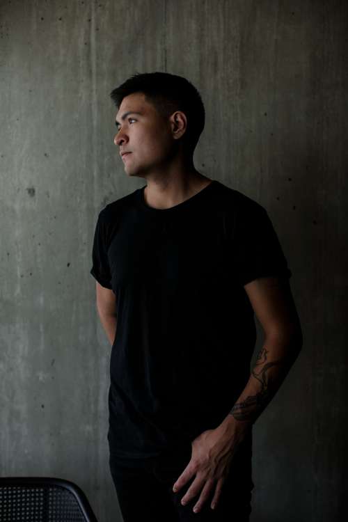 Profile Of A Person In Black Tee Photo