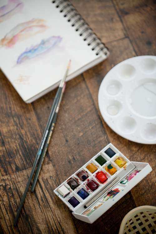 Water Color Supplies On A Wooden Table Photo