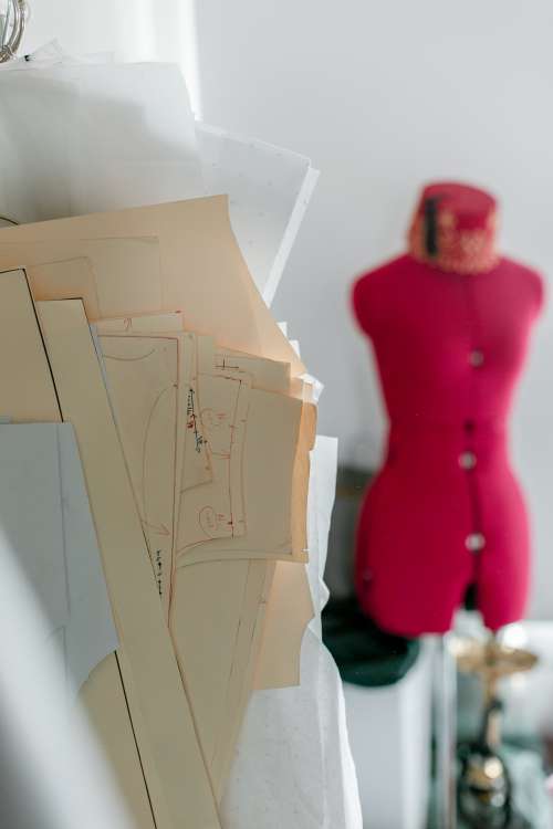 Sewing Patterns And A Pink Mannequin Photo
