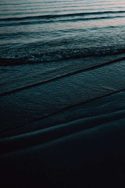 Texture Of Dark Waves On The Shore Photo