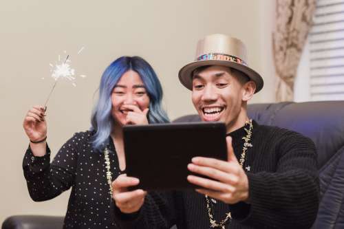 Couple Video Calling Family On New Years Eve Photo
