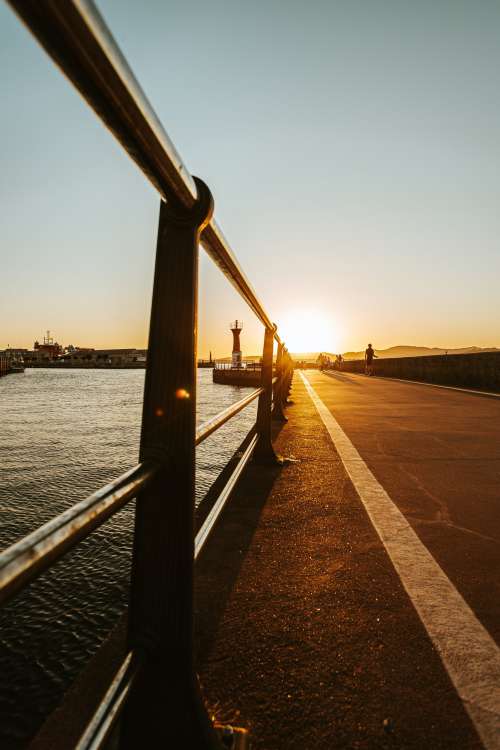 Bike Path By The Water At Sunset Photo