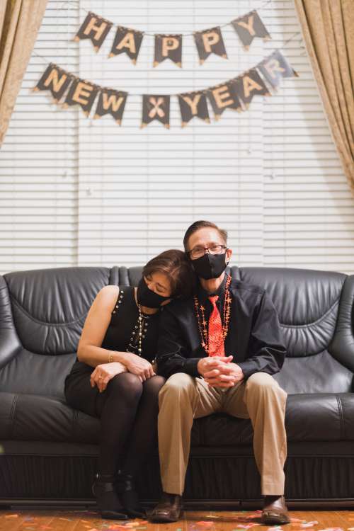 Parents Celebrating New Year 2021 At Home Photo
