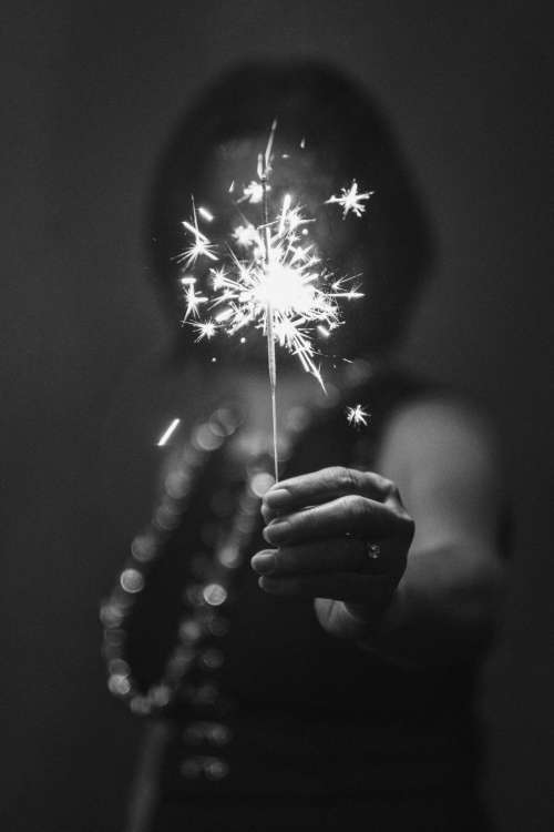 Woman Holding A Sparkler Celebrating 2021 Photo