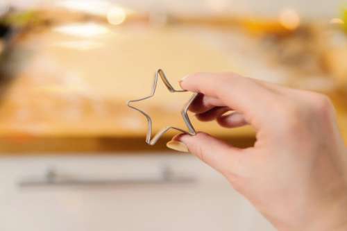 Baking cookies. Christmas concept. Detail of star-shaped baking mold