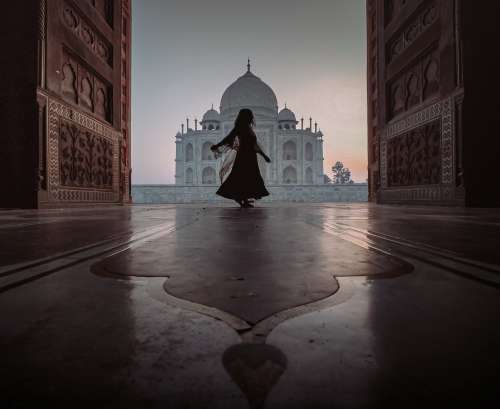 Person Dances In Door Way With A View Of The Taj Mahal Photo