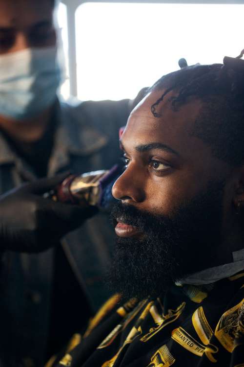 Profile Of A Man Getting His Hair Cut Photo