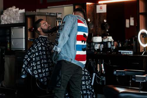 Man Gets His Beard Trimmed In A Barber Shop Photo