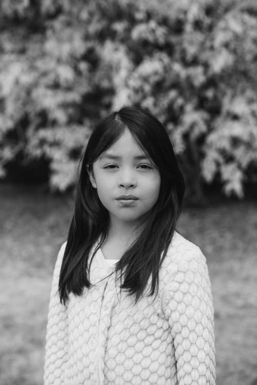 Moody Portrait Of A Child In Black And White Photo