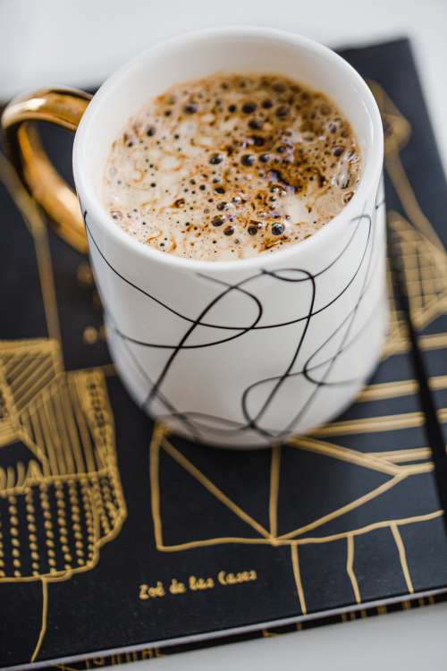 Creamy Cup Of Hot Cocoa In A White Mug Photo