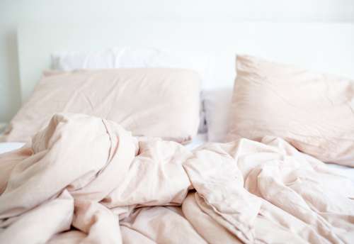 Cozy Light Pink Bed Scene Photo
