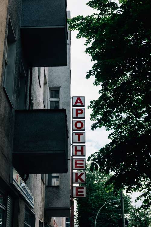 Grey Building With The Word Apotheke Along The Side Photo