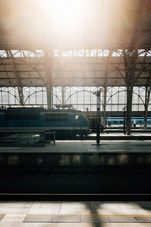 Train Station With Two Blue Trains Waiting Photo