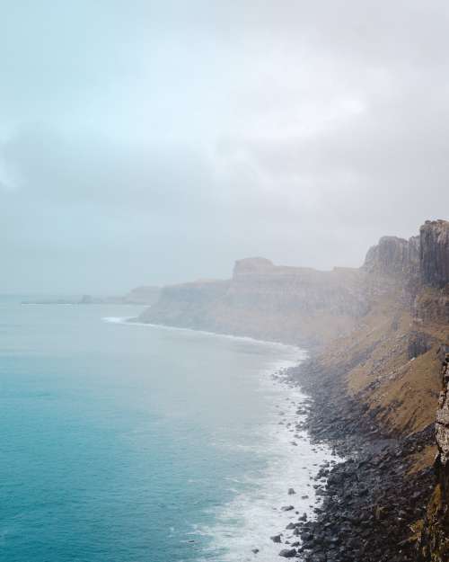 Cliffs And Black Rocks And Ocean View Photo