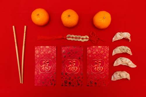 Flatlay With Red Cards With Gold Coins On Red Rope Photo
