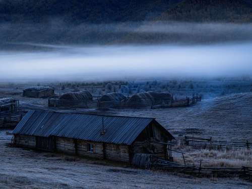 Quiet Wooden Farm With Low Clouds Photo