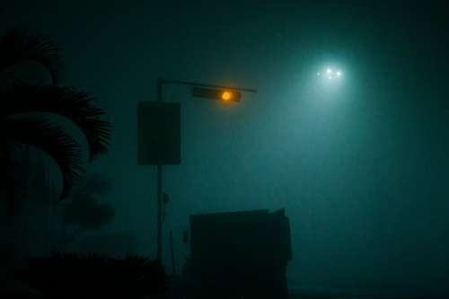 Yellow Traffic Light Through Thick Fog Photo