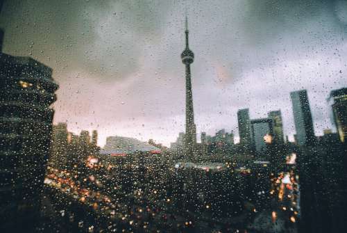 Toronto Skyline At Night Through Raindrop Covered Window Photo