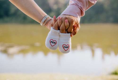 Small Socks With The Words Mom And Dad Photo