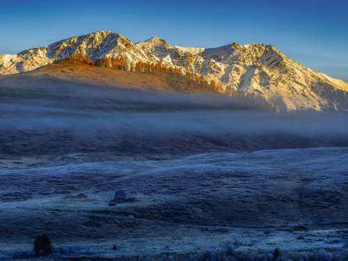 Sunrises On Snow Covered Mountains Towards Frosty Hills Photo