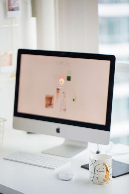 White Desktop Computer With Coffee Mug Photo