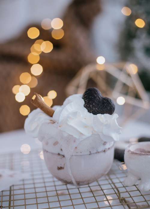 Cup Topped With Whipped Cream Chocolate And A Cinnamon Stick Photo