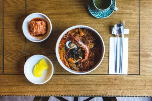 Korean spicy seafood soup with king prawns from top view