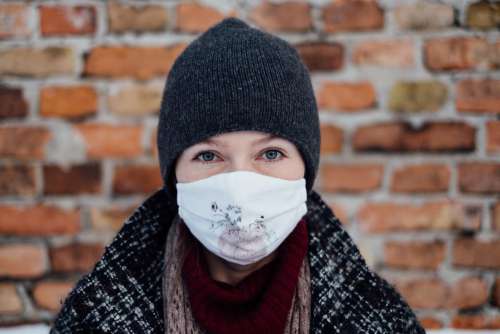 A female wearing a protective face mask 4