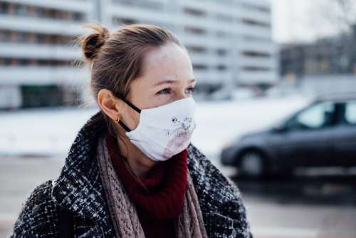 A female wearing a protective face mask 2