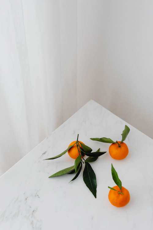 Mandarins on white marble