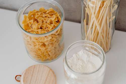 Eco-friendly kitchen utensils and food in jars