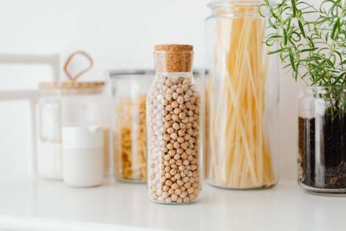 Eco-friendly kitchen utensils and food in jars