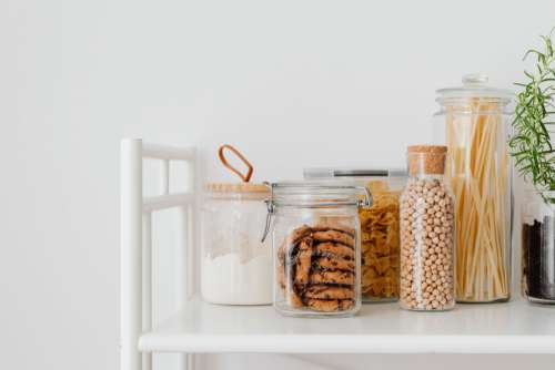 Eco-friendly kitchen utensils and food in jars