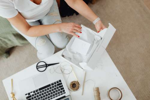 Woman working online e-commerce shopping at her home