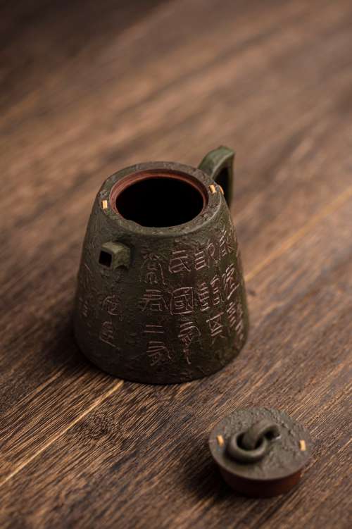Metal Teapot Sits With Its Lid Off On A Wooden Surface Photo