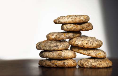 Cookies Stacked In Two Piles On White Photo