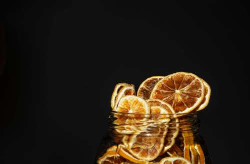 A Jar Overflowing With Dried Lemon Slices Photo