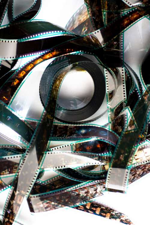 A Film Reel Lays Flat Catching The Sunlight Photo