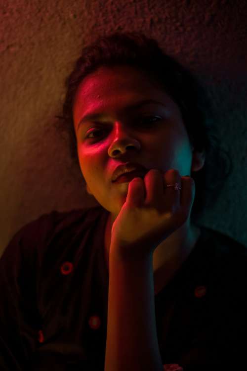 Portrait Of A Person In Multiple Colored Light Photo