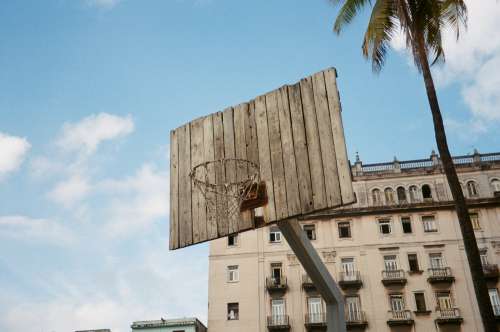 Rustic Basketball Net With A Wood Panel Backboard Photo