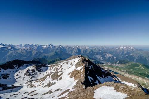 Rocky Mountain Tops Against A Blue Sky Photo