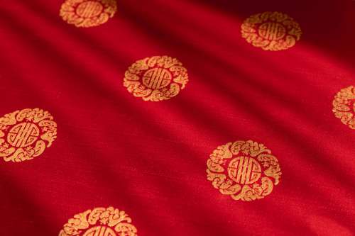 Gold Pattern On Red Brocade Fabric Photo