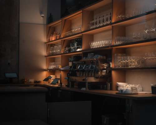 Bar Filled With Glassware And An Espresso Machine Photo