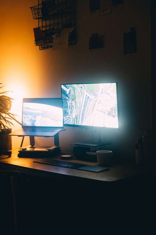 Home Office Lit By Computer Monitors Photo