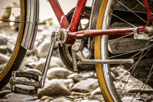 Wheels And A Pedal Of A Red And Silver Bicycle Photo