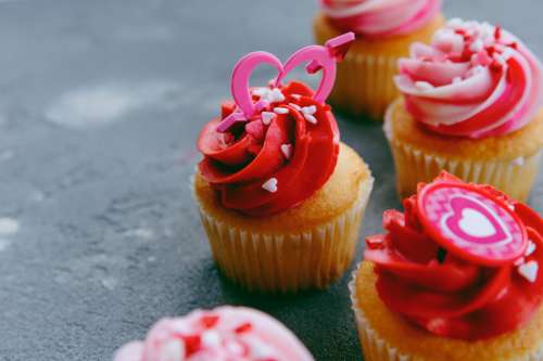 Cupcakes With Red Icing And Small Confetti Hearts Photo