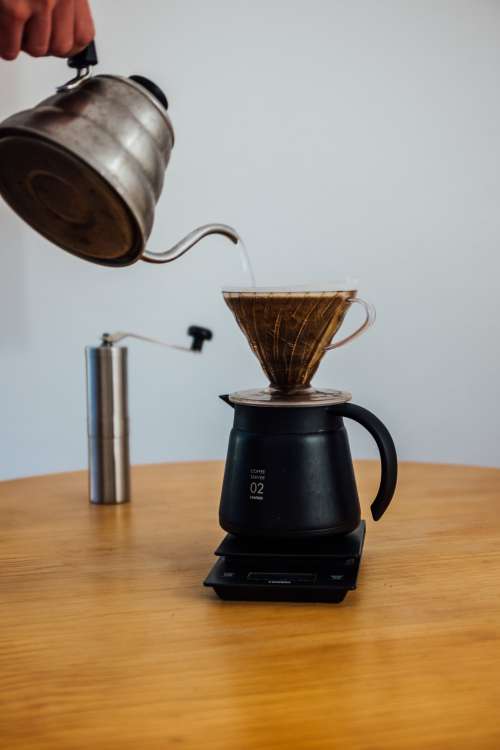 Wooden Table With A Scale And Pour Over Coffee Photo