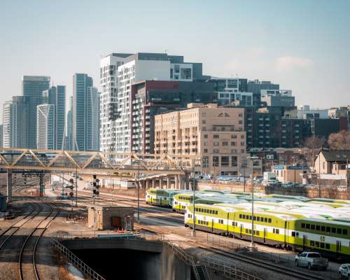 A Large White Bridge Over A Train Station Photo