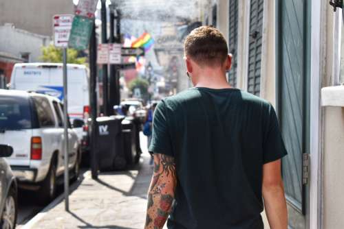 Tattooed Man Takes A Stroll In Summer Photo